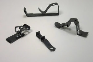 Fourslide parts for the Lighting Industry. These parts are finished with Black Oxide and wax or Black Phos.